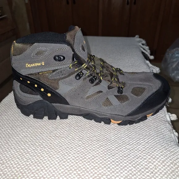 A pair of BearPaw grey hiking boots in a men's size 13. They're new without box.
