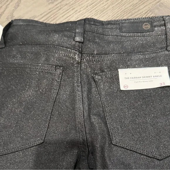 NWT AG Farrah Skinny Ankle Black gunmetal  w/shimmering micro-glitter finish. 23