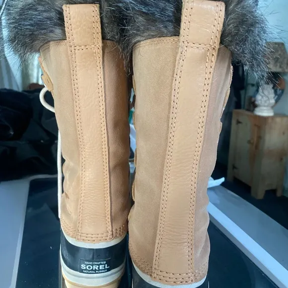 Sorel Tan and Black Winter Boots with Fur Lining and Lace-Up Design
